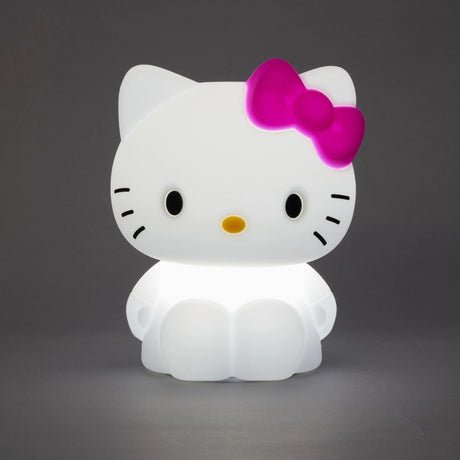 The Hello Kitty Silicone Night Light features a cartoon-like white cat with a pink bow on its left ear, illuminated against a gray background.