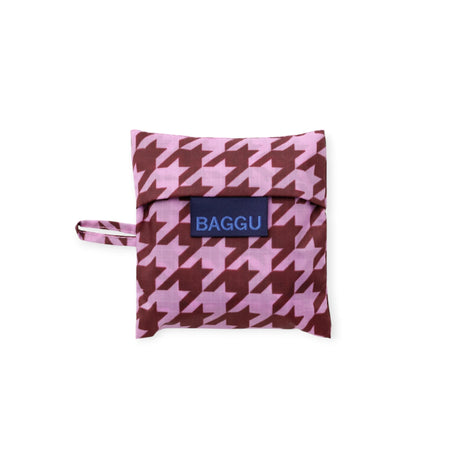 Baby Baggu baby bag in pink houndstooth with fold-over pouch and handle