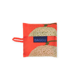 The Baby Baggu Reusable Bag - Yubari by Baggu is a small red fabric pouch with a melon graphic and a blue "BAGGU" label. Made from recycled nylon, it's eco-friendly and ideal for everyday use.