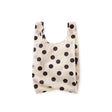 Cream polka-dot baby tote bag with short handles and open top, black dot pattern