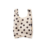 Cream polka-dot baby tote bag with short handles and open top, black dot pattern