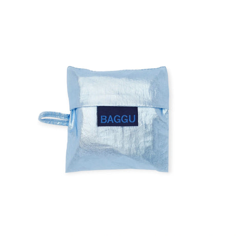 The Baby Baggu Bag in metallic light blue, made from recycled nylon, includes a handle and displays the "BAGGU" label prominently on the front.