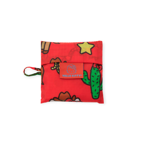 Folded red Baby Baggu reusable bag with western-themed Hello Kitty prints including cactus and stars