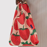 Baby Baggu bag with strawberry print, tote held by top handle