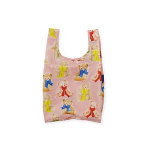 Folded pink Baby Baggu bag featuring cute teddy bears with colorful bow ties and a blue Baggu label tag