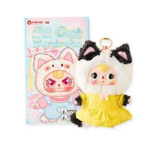 Baby Three - Kitten Wardrobe Keychain Blind Box featuring doll in yellow dress and black white cat costume with box.