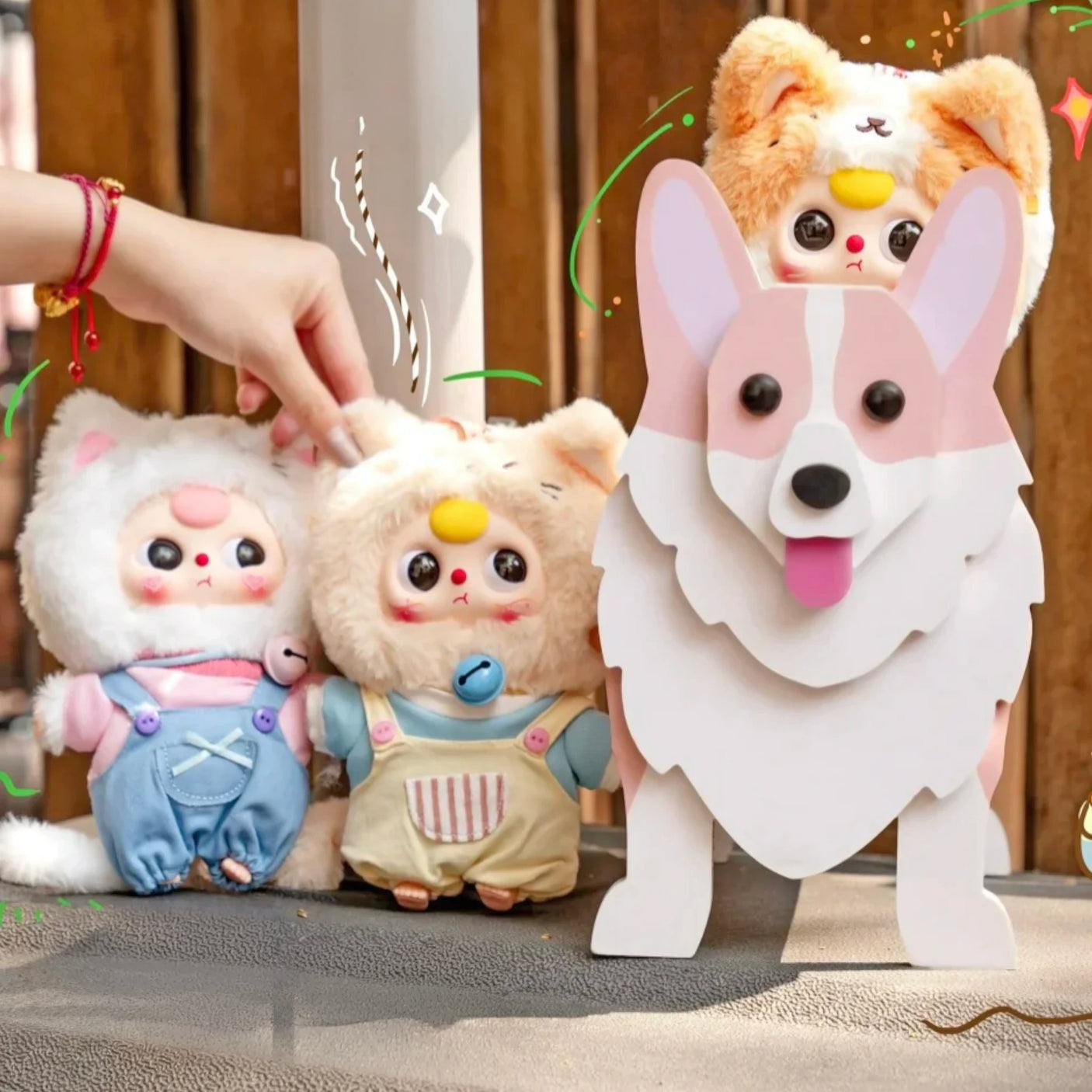 Baby Three - Kitten Wardrobe Keychain Blind Box dolls in cat costumes with bell necklaces and colorful outfits beside a dog-shaped holder