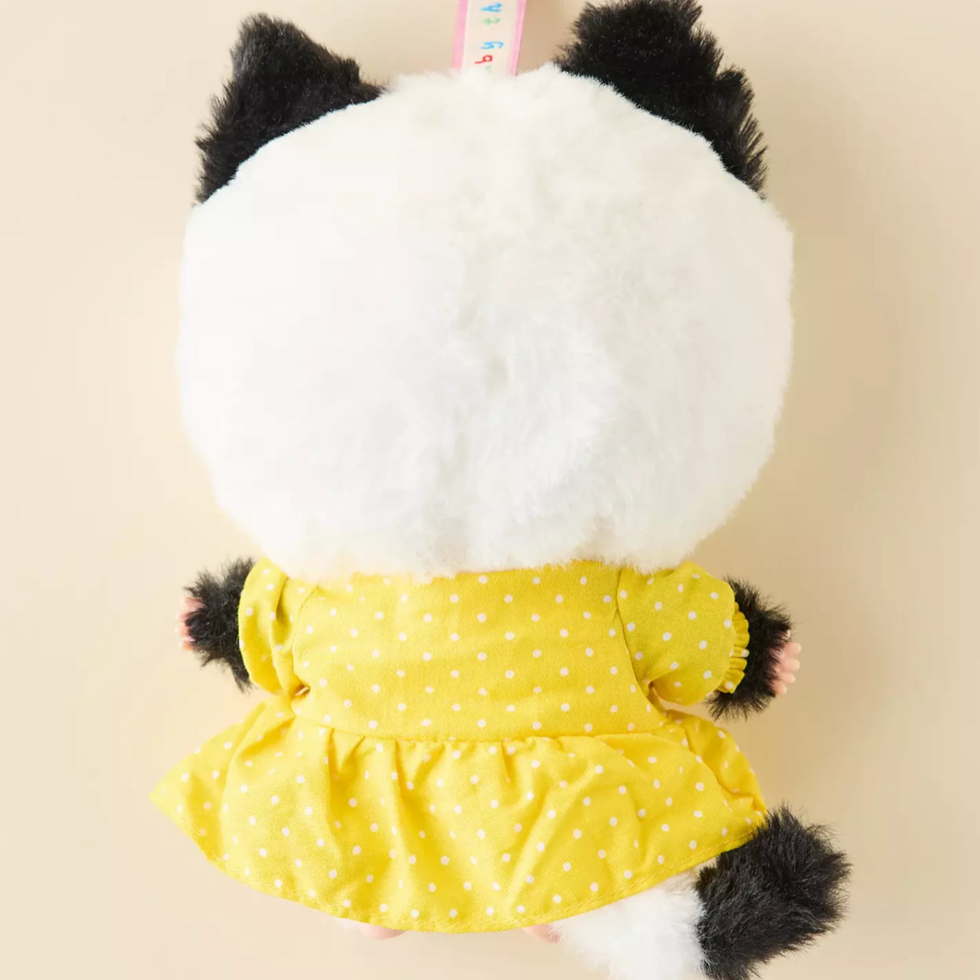 Baby Three - Kitten Wardrobe Keychain Blind Box doll in white and black cat costume with yellow polka dot dress backside view