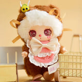 Baby Three - Liila's Chef Kitten Blind Box plush doll in soft brown and white onesie with large cream bow and bee accessory