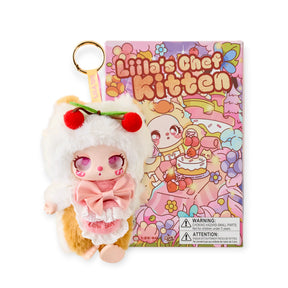 Lilla's Chef Kitten plush toy in an apron with blind box packaging on a white background