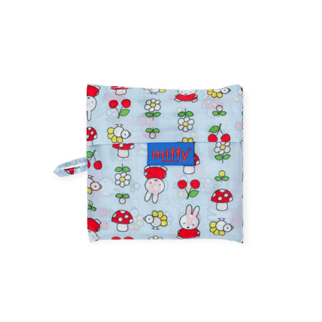 The Baggu Standard Baggu x Miffy Garden is a light blue reusable pouch made from recycled nylon, featuring Miffy with mushrooms, flowers, cherries, and a center "miffy" logo patch.