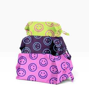 3-piece zippered storage pouch set with smiley circle patterns, bright pink and purple
