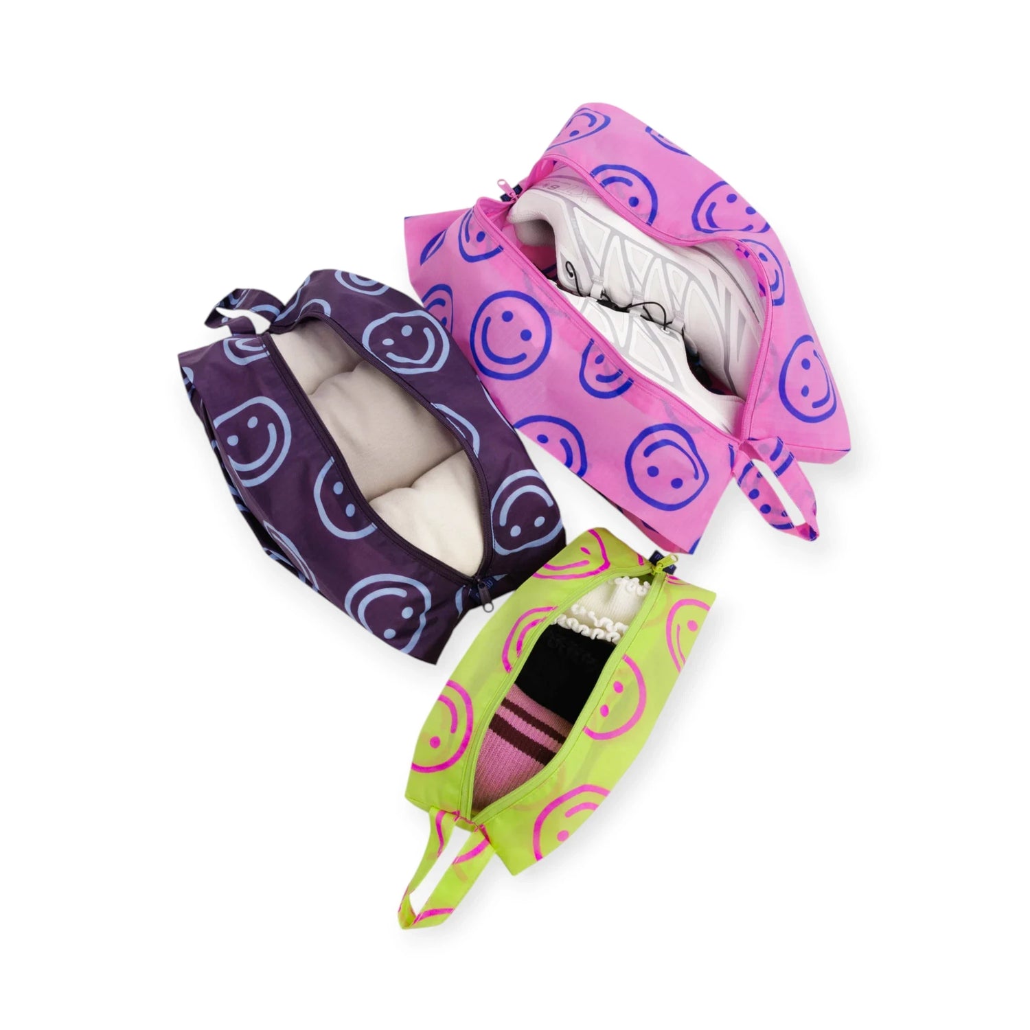 3-piece storage pouch set with smiley circle patterns, open with visible folded items