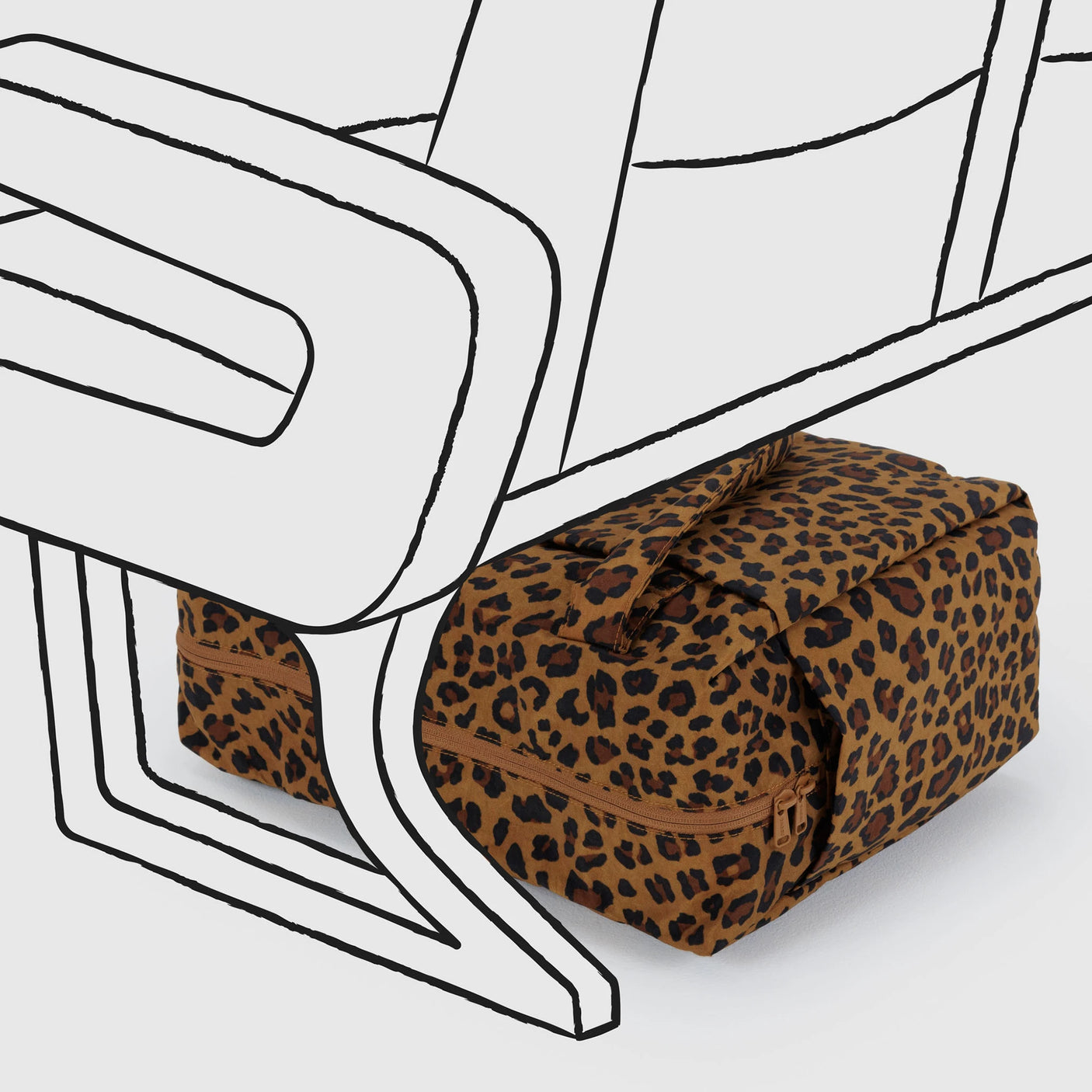 A Baggu Small Cloud Carry-on - Leopard by Baggu sits under a stylized, black-and-white illustrated airplane seat.