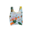 A Baby Baggu Reusable Bag by Baggu, featuring a lively cat design intermixed with flowers and plants on a white backdrop.