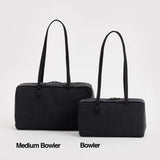 Two black bowler bags with long straps sit side by side on a white background. The left is the Baggu Medium Nylon Bowler Bag - Black by Baggu; the right is labeled "Bowler.