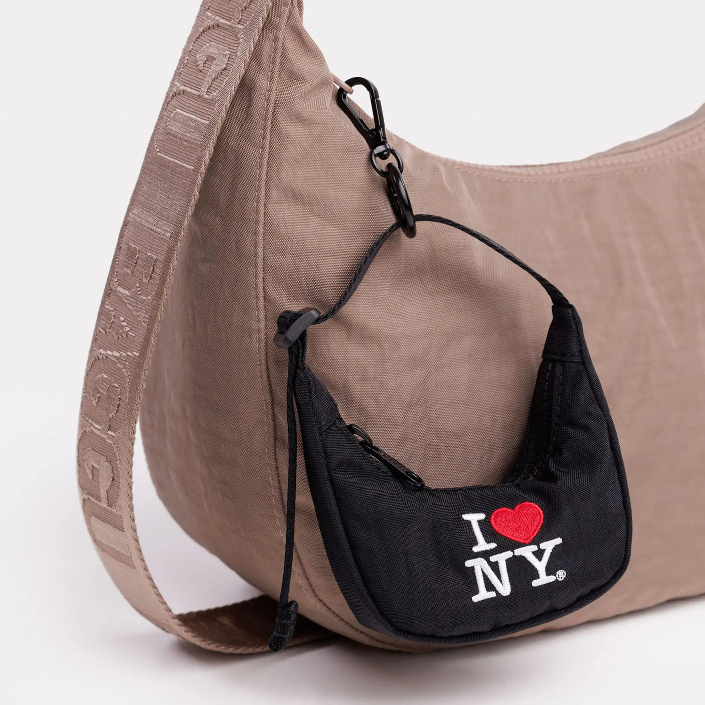 Black crescent bag charm with I Love NY heart logo and drawstring cord