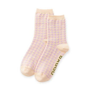 Pair of crew socks with lilac-pink houndstooth and tan toes, folded