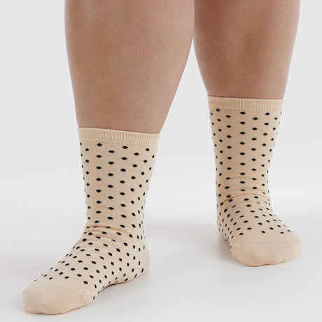 Cream crew socks with black micro polka dots and ribbed cuffs