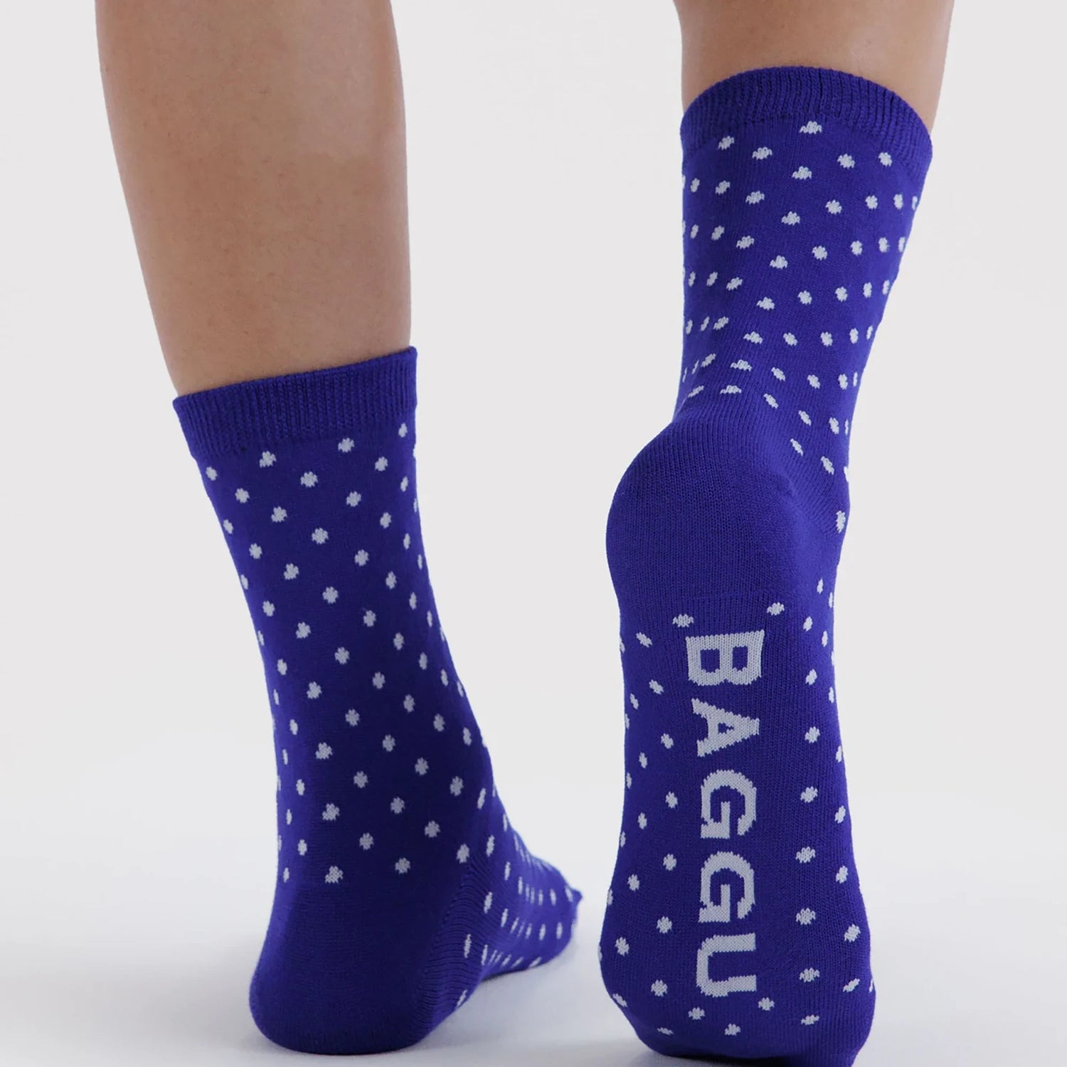 Crew socks in blue with white polka dots and BAGGU logo on cuff