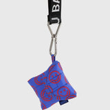 Baggu mini puffy earbuds case in cobalt blue with smiley circles; keychain clip