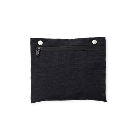 Small black fabric pouch with zipper closure and two silver snap buttons on top edge isolated on white background