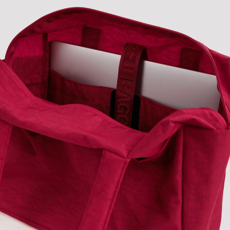 Cherry red tote bag interior with zip opening and inner sleeve pocket