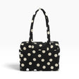 Black tote bag with cream polka dots and top handle, open-top pouch style