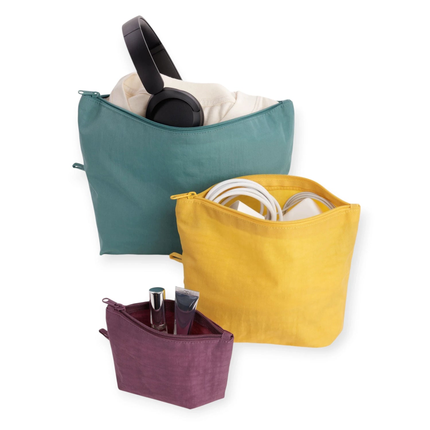 Canvas pouch set with teal, yellow, and plum pouches holding headphones and small items.