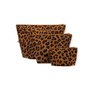 Set of three leopard print fabric zipper pouches in small, medium, and large sizes on white background