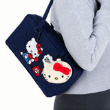 Navy Hello Kitty x Baggu Nylon Bowler Bag with front Hello Kitty graphic and matching plush bag charm, gallery image 1
