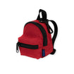 The Baggu Backpack Charm is a compact red bag made from recycled heavyweight nylon, with black zippers and straps.