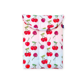 Quilted fabric pouch with red and purple cherry print on white background and flap closure