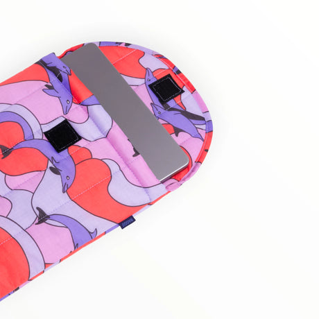 Puffy laptop case interior lining and black strap on purple orange dolphin print