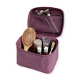 Wild plum large cosmetic case opened, showing mesh pocket and toiletries inside