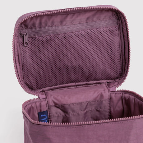 Wild plum cosmetic case interior view with mesh pocket and zipper pull, blue tag