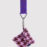 Baggu logo keychain with lapis blue strap, metal clip, attached purple patterned pouch