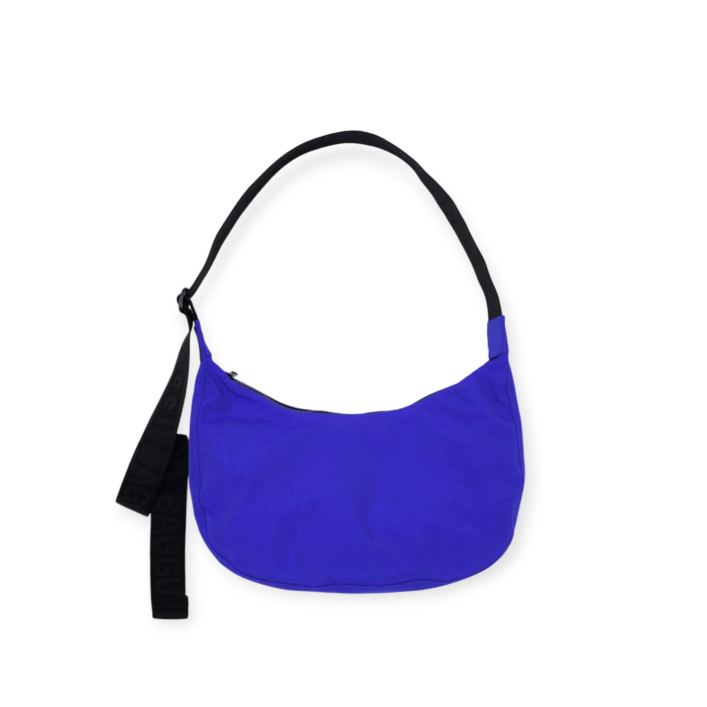 The Baggu Medium Nylon Crescent Bag - Lapis Blue includes a black strap and secure zip closure, crafted from recycled nylon, elegantly presented against a pristine white background.