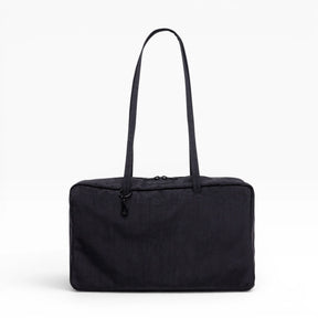 Medium nylon bowler bag in black with top handles and side zipper