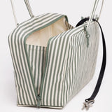 Medium nylon bowler bag with sage green and white stripes, zip top, side pocket, handles