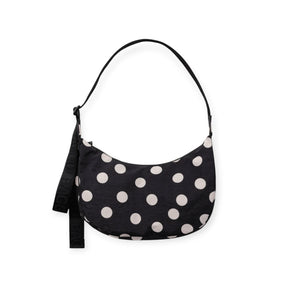 Medium nylon crescent bag with black fabric and cream polka dots, top handle.