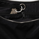 Black nylon crescent bag with zip top and metal keyring pull