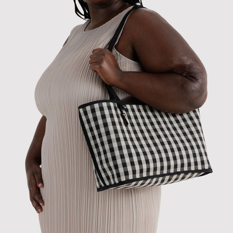 Black-and-white checkered nylon medium tote with top handles and zip closure