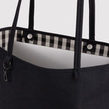 Medium reversible nylon tote in dark black with gingham lining, top handles and zip pocket