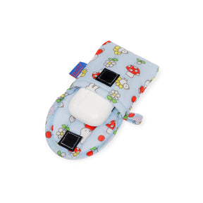 Light blue Miffy x Baggu puffy earbuds case with floral and ladybug print, open showing white earbuds inside, angle two