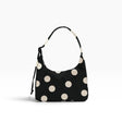 Black mini shoulder bag with cream polka dots and drawstring shoulder strap
