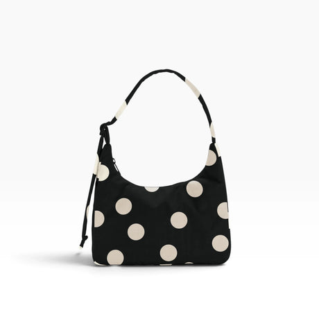 Black mini shoulder bag with cream polka dots and drawstring shoulder strap
