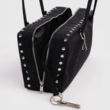 Black bowler bag open view, studded zipper fronts and metal keyring clasp