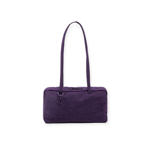 Rectangular deep purple fabric shoulder bag with long slim handles and top zipper closure on white background