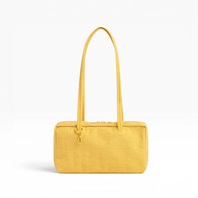 Baggu nylon bowler bag in sunflower yellow with top handles and front zipper detail